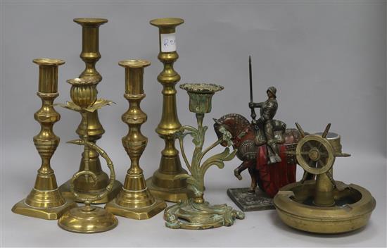A collection of brass candlesticks and Austrian figurative table striker etc